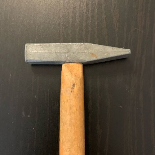 Small hammer used, as shown
