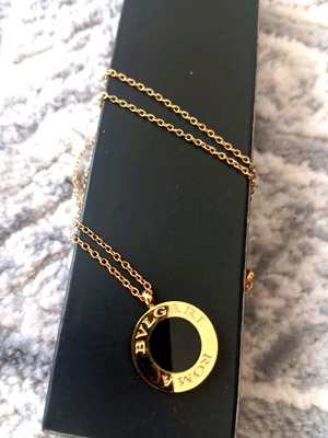 Authentic women's necklace used, stainless steel, black and gold