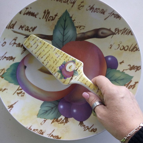 Ceramic serving platter with matching spatula, fruit design