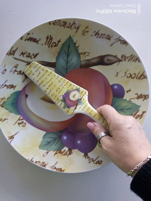 Ceramic serving platter with matching spatula, fruit design