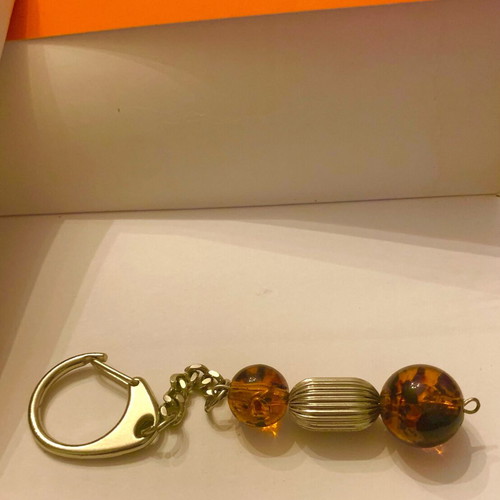 Keychain with metal elements and amber-type beads new, brown and silver