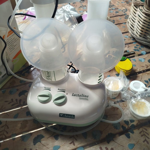 Ameda Double Breast Pump like new with 3 bottles and milk storage bags
