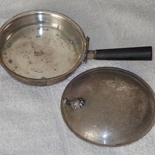 Antique heating vessel used for bed