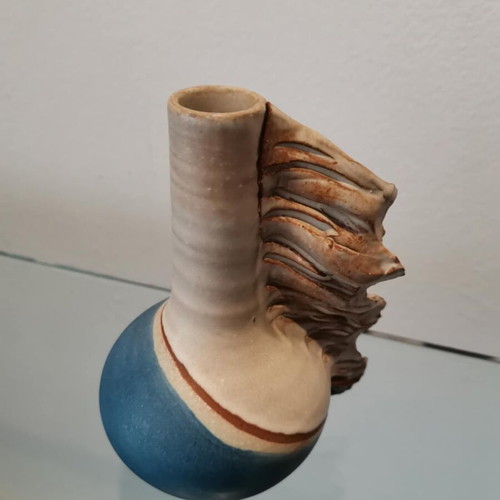 Handmade clay vase used with wavy finish