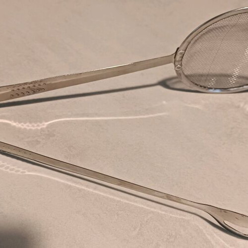 Handheld strainer tong like new, unused