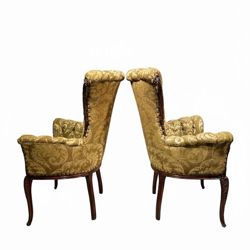 Hollywood Regency tufted armchairs used, mahogany carvings, set of two