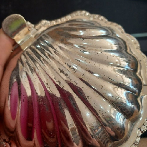 Vintage shell-shaped serving dish used with wear marks