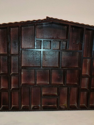 Wooden decorative wall shelf in house shape used