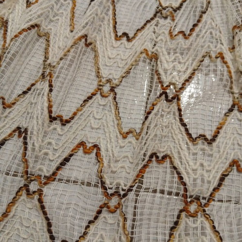 Pair of beige and brown curtains with ruffles, heavy knit