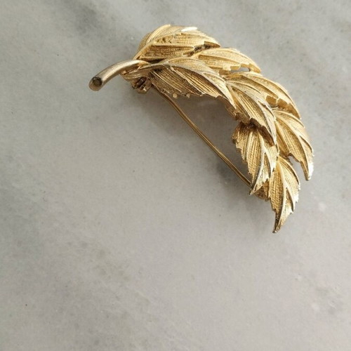 Pin used, old, gold-colored