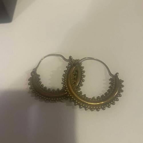 Handmade earrings used, gold-colored hoop shape