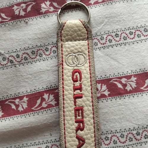 Gilera keychain like new, beige and red
