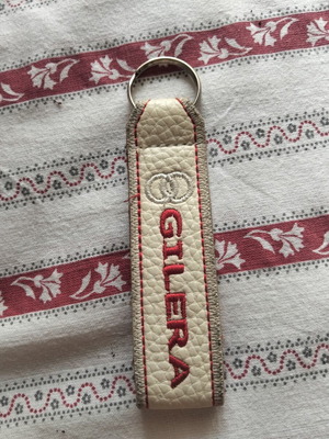 Gilera keychain like new, beige and red