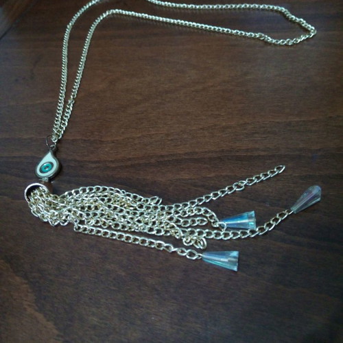 Enameled eye pendant used with gold chain and tassels
