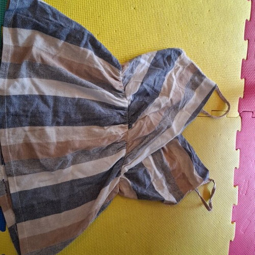 Linen sleeveless top used with earth-tone stripes, size M