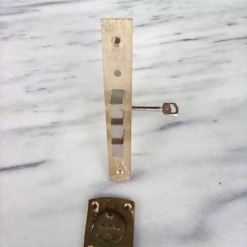 Triaina lock used with one key and metal keyhole cover