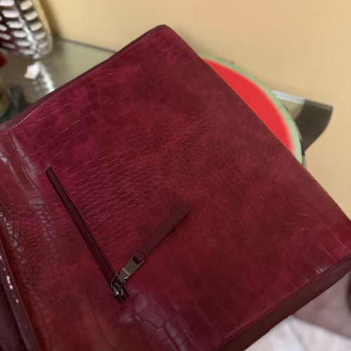 Burgundy embossed women's handbag with geometric details