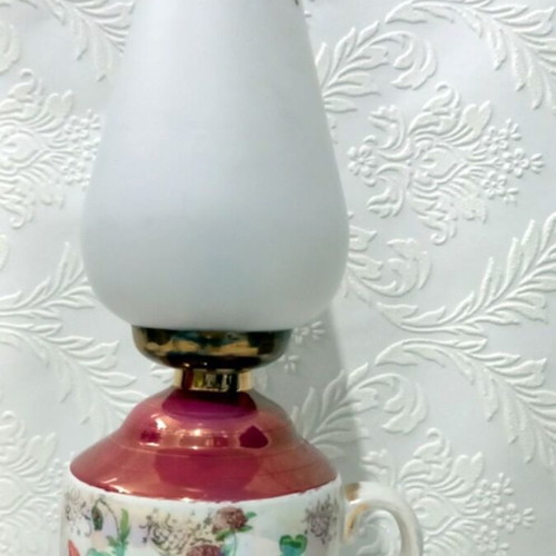 Electric ceramic vintage lamp used with floral decoration