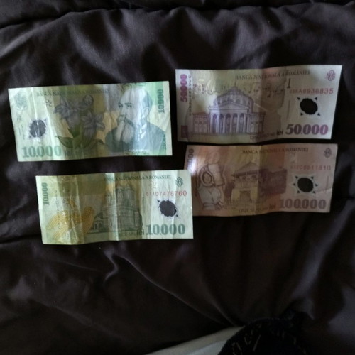 Romanian banknotes used, 10 and 50,000 lei