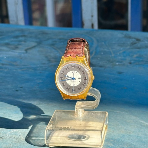 Vintage Swatch Swiss watch 34mm, transparent yellow case, brown strap