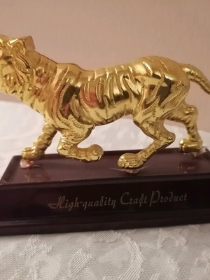 Table decor with gold-plated tiger like new