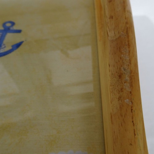 Vintage wooden breakfast tray with nautical theme used
