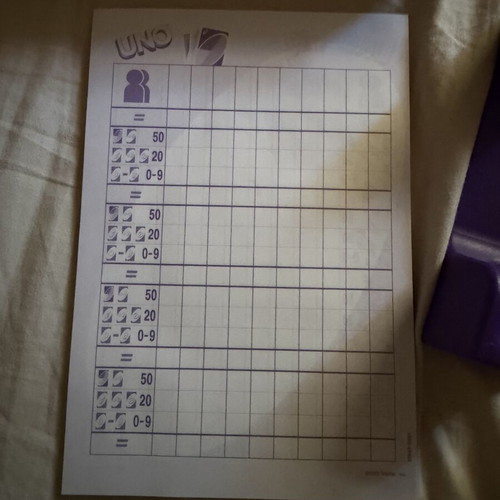 Uno Deluxe card game used with base and score notebook