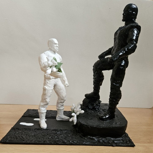 Handmade memorial statue with soldier figure