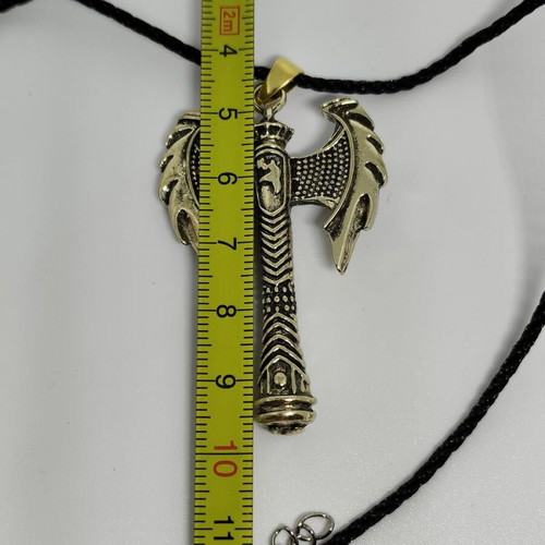 Pendant Double Axe like new, gold-colored steel with black cord