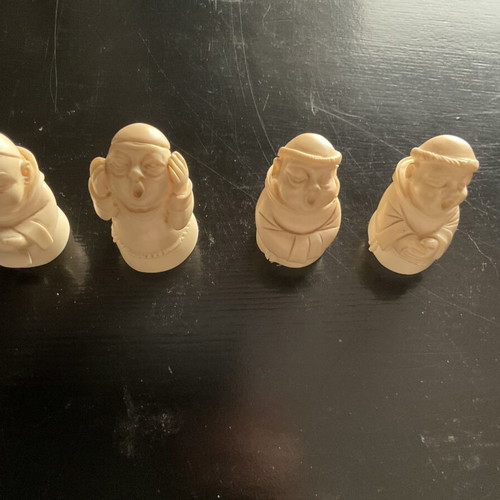 Set of 4 used alabaster monks with humorous poses