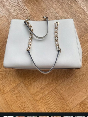 Michael Kors white tote bag with floral and dragonfly details