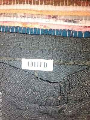 Glitter pants used, green and gold, with small hole