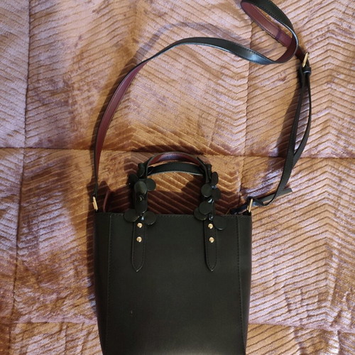 Vintage leather black bag used with flowers and burgundy interior
