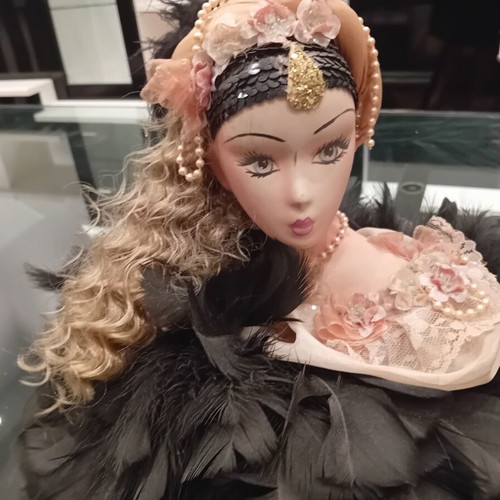 Vintage porcelain doll with feathers, handpainted, used