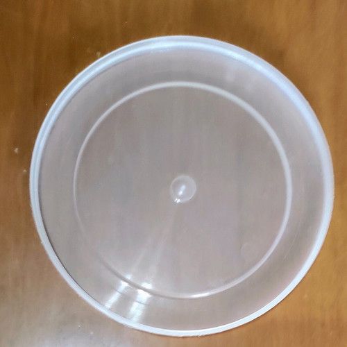 Kitchen utensils used, strainer in tupperware with lids