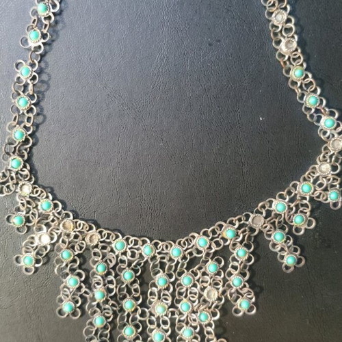 Vintage necklace used with turquoise stones and plated metal