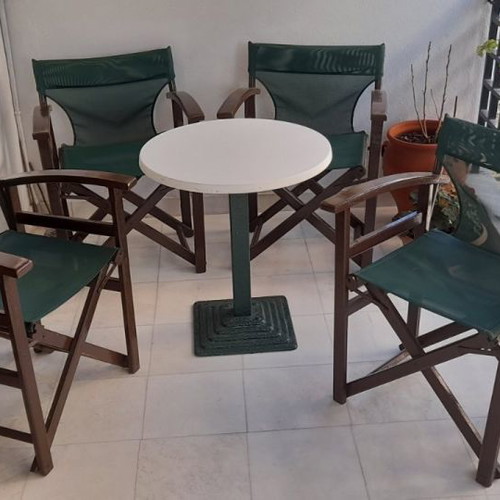 Outdoor lounge furniture used with 4 director chairs and metal table