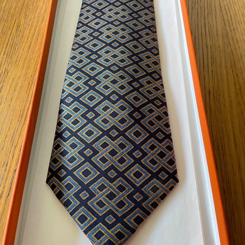 Hermes silk tie new with dark blue background