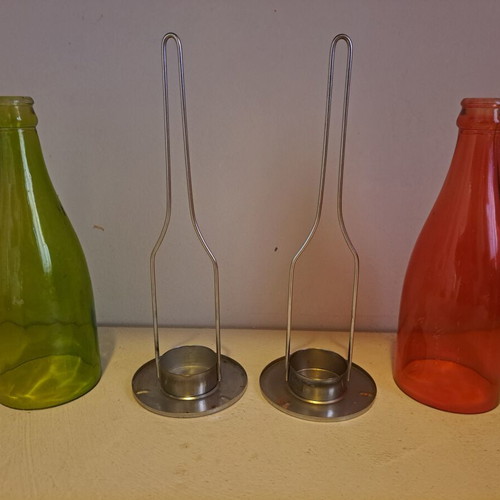 Set of 2 decorative candle holders with metal base and colored glass bottles