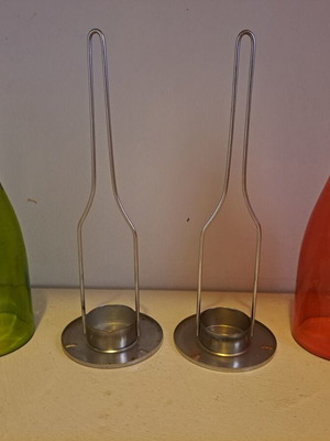 Set of 2 decorative candle holders with metal base and colored glass bottles