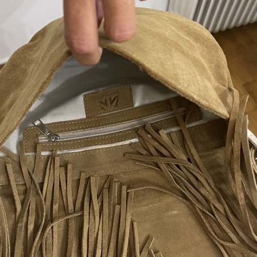 Suede leather shoulder bag used with fringes and silver details