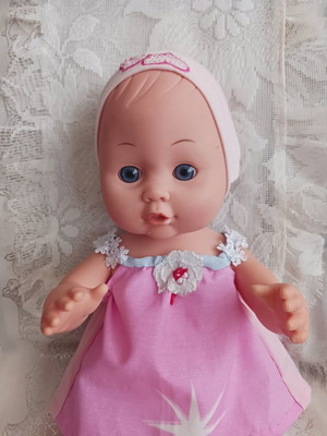 Baby Suzi doll like new with handmade clothes