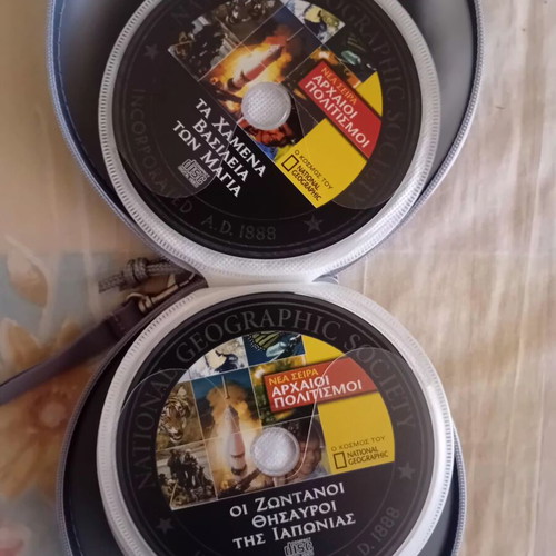 DVD collection like new, pack of 33 with movies, documentaries, and shows