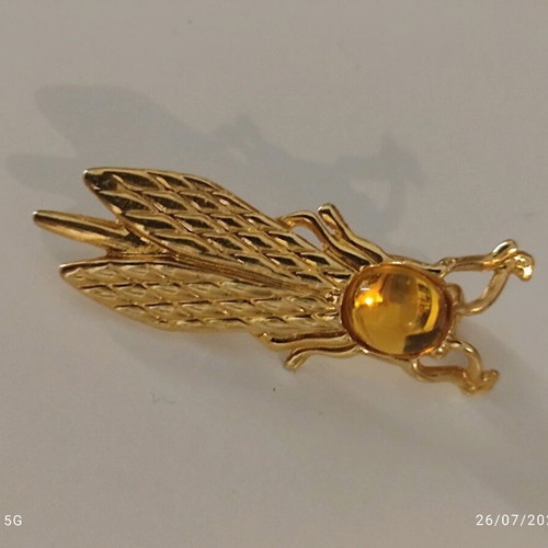 Yves Rocher gold plated brooch like new, cicada design with cabochon stone