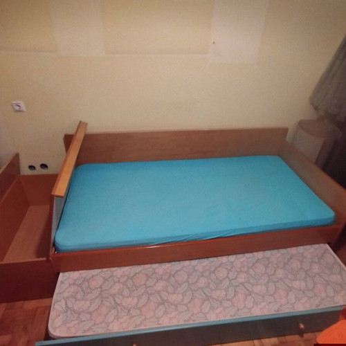 Wooden single bed with second pull-out bed and mattresses used