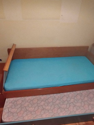 Wooden single bed with second pull-out bed and mattresses used