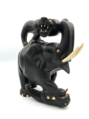 Vintage handmade ebony wood sculpture of elephant and lions