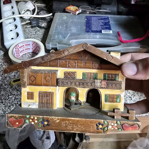 Vintage alpine wooden house used with figures
