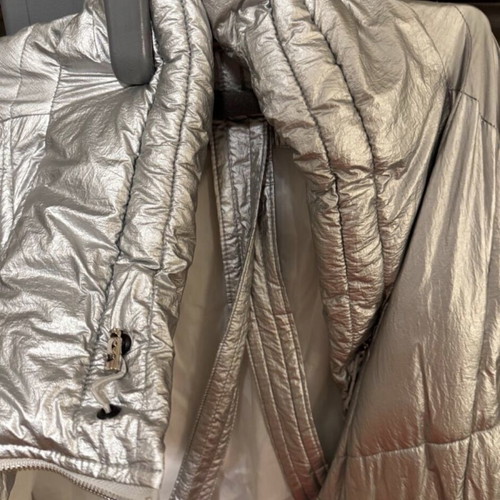 Silver jacket like new, very warm, one size with internal straps