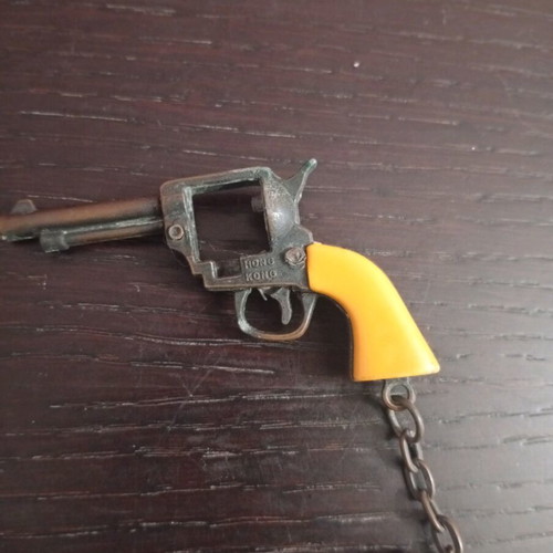 Vintage metal keychain gun used with cap gun function